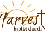 Harvest Baptist Church logo with a sun behind it